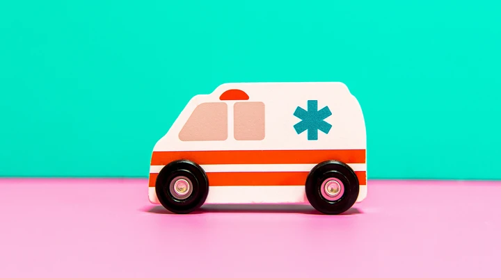 Eine zweidimensionale, minimalistische Illustration eines Krankenwagens 