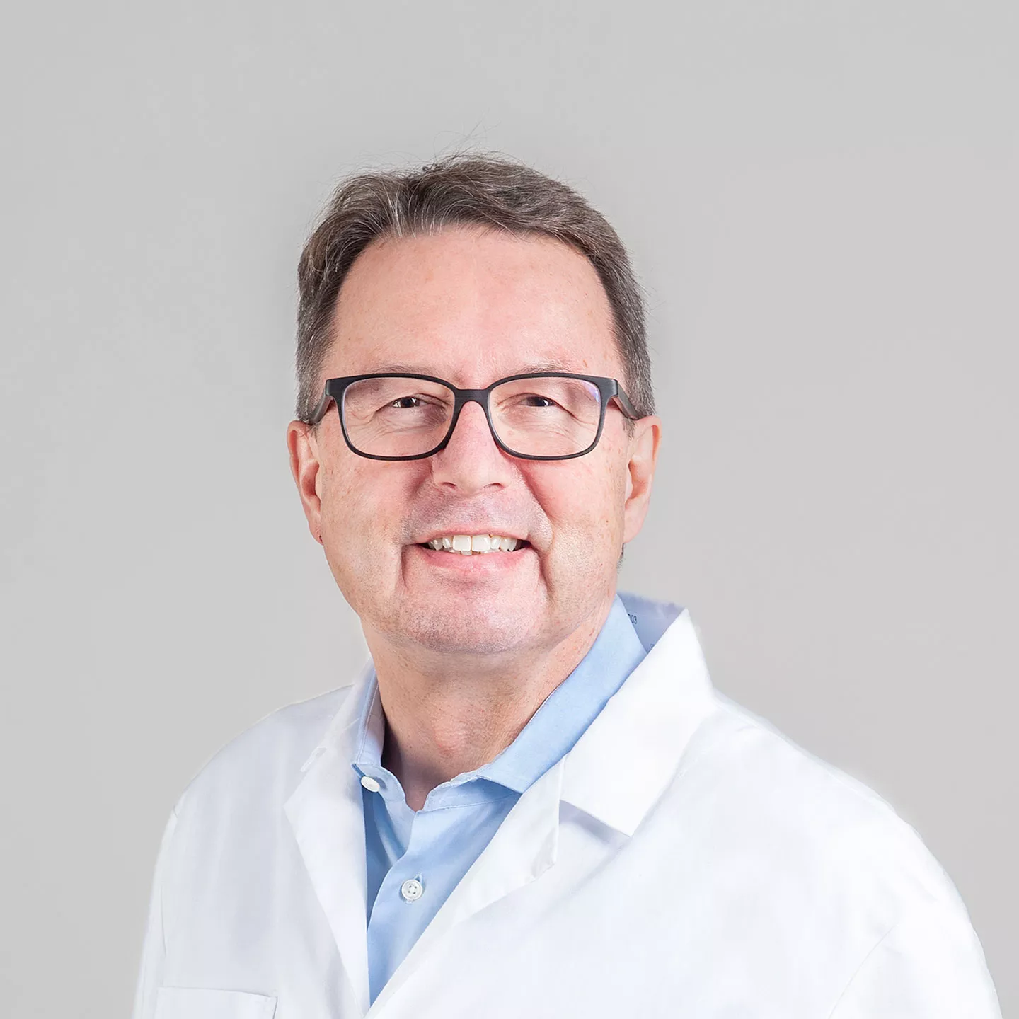 Ein Portrait von dem Arzt Michael Grotzer von der Abteilung Onkologie